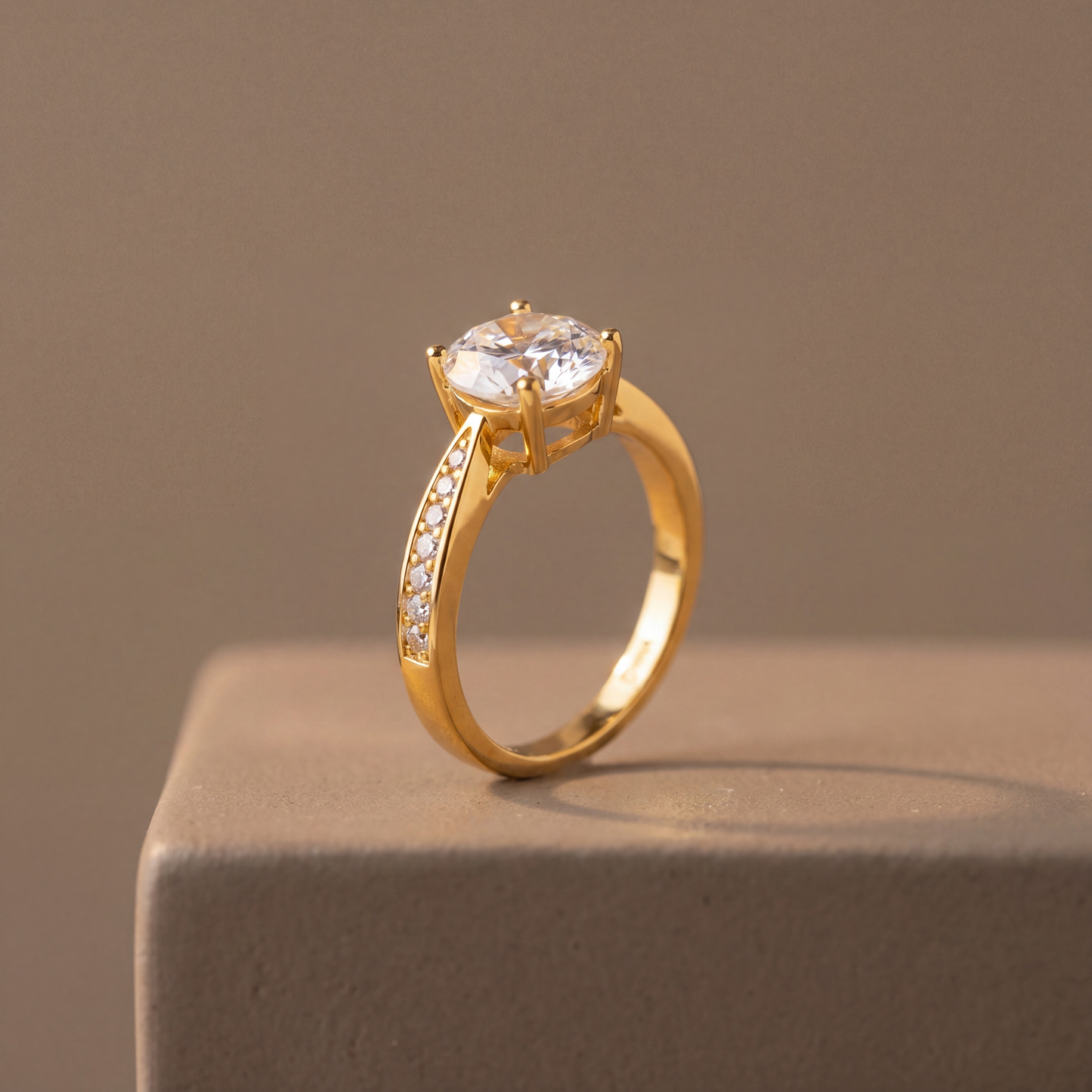 Gold ring with a large diamond on a brown background