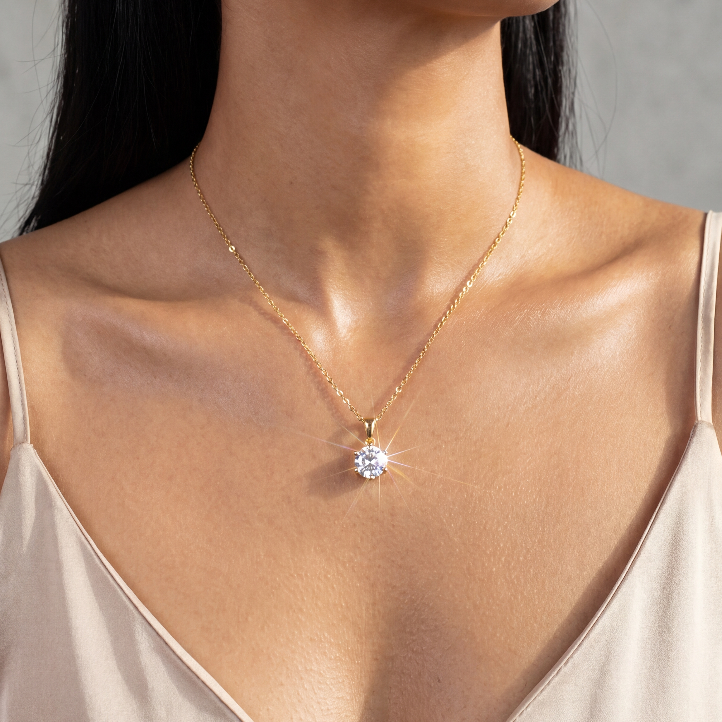Woman wearing MOHRA Round Solitaire Pendant in 18K gold, 1ct round moissanite