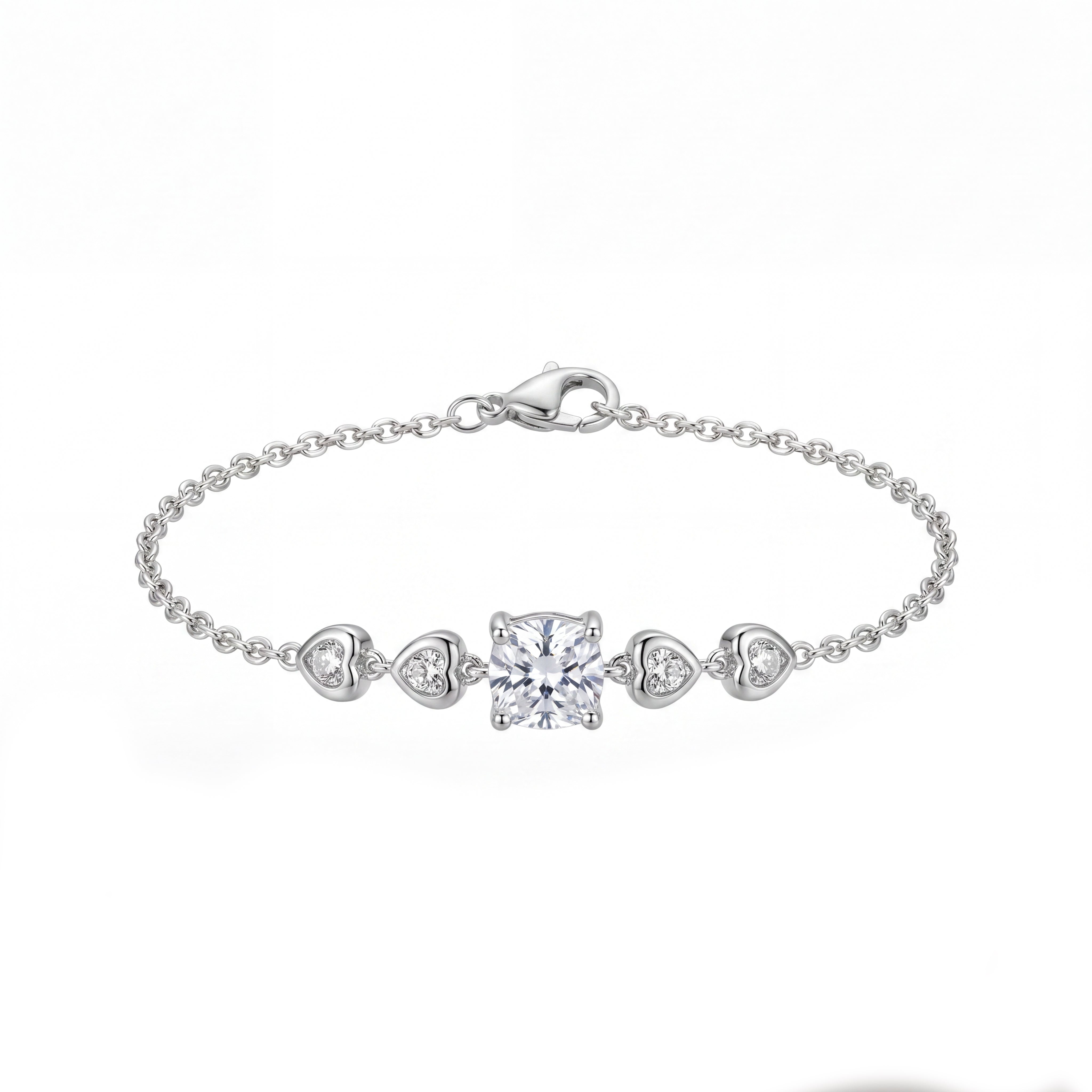 Silver bracelet with heart and square diamond charms on a white background