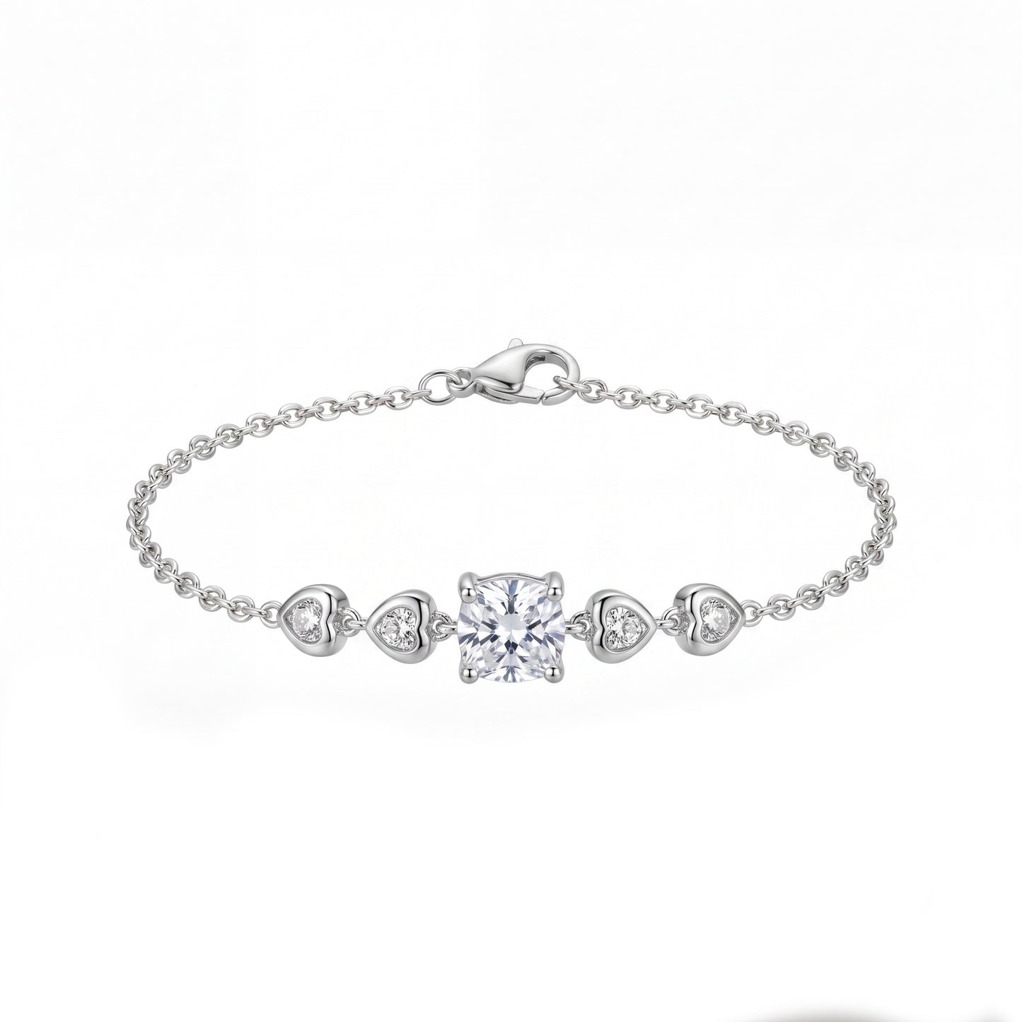 Silver bracelet with heart and square diamond charms on a white background