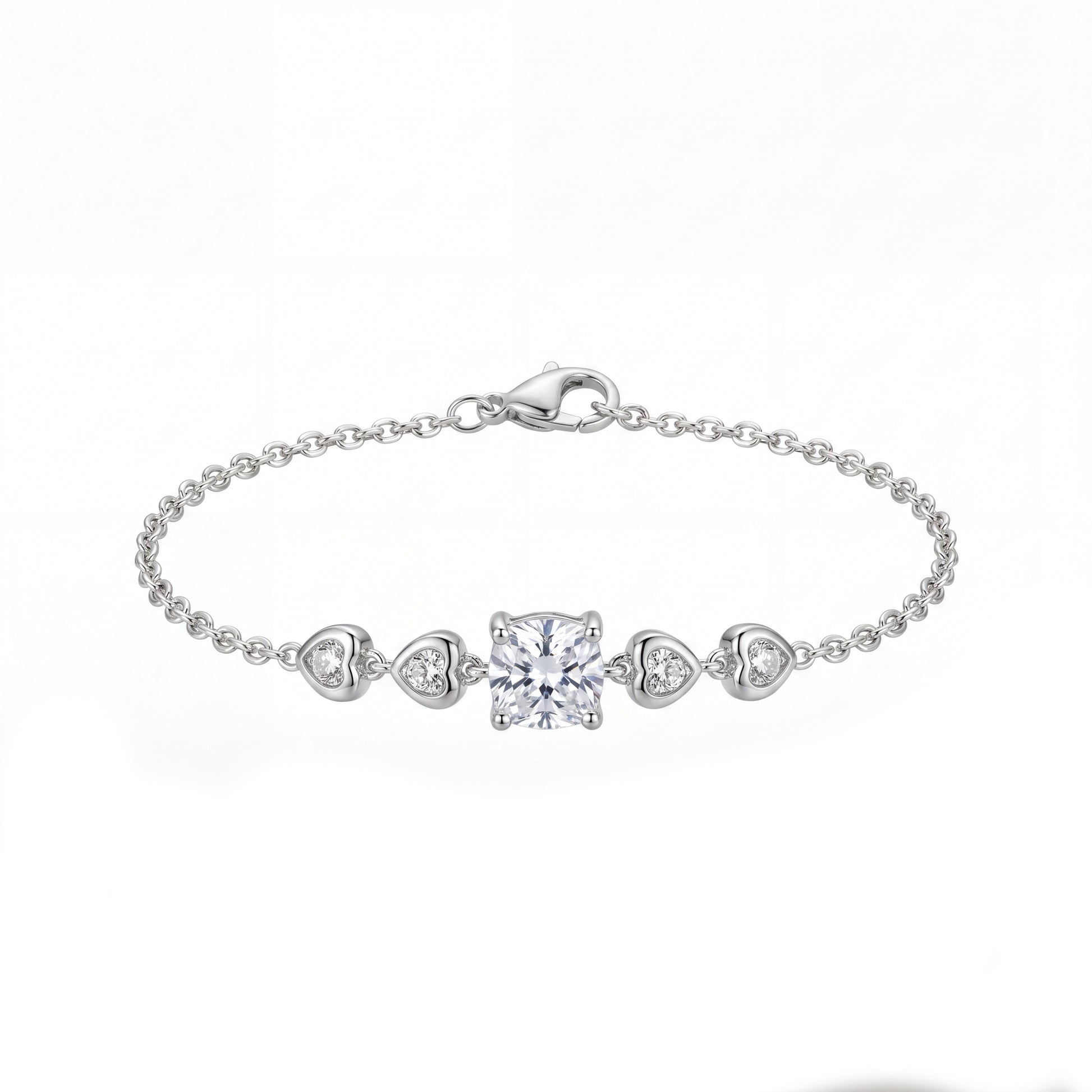 Silver bracelet with heart and square diamond charms on a white background