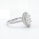 Diamond ring with a white gemstone and smaller diamonds on a white background