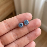 The MOHRA Blue Moissanite Studs, ocean-blue round brilliant moissanite studs, close detail