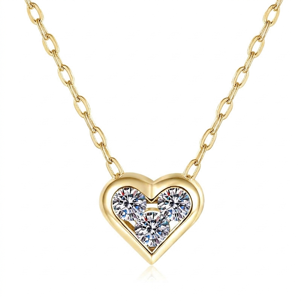 The MOHRA Petite Heart Pendant with three brilliant moissanite in an 18K gold bezel