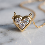 The MOHRA Petite Heart Pendant flat lay, 18K gold-plated sterling silver