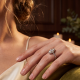 Close-up of a hand wearing a ring with a blurred background