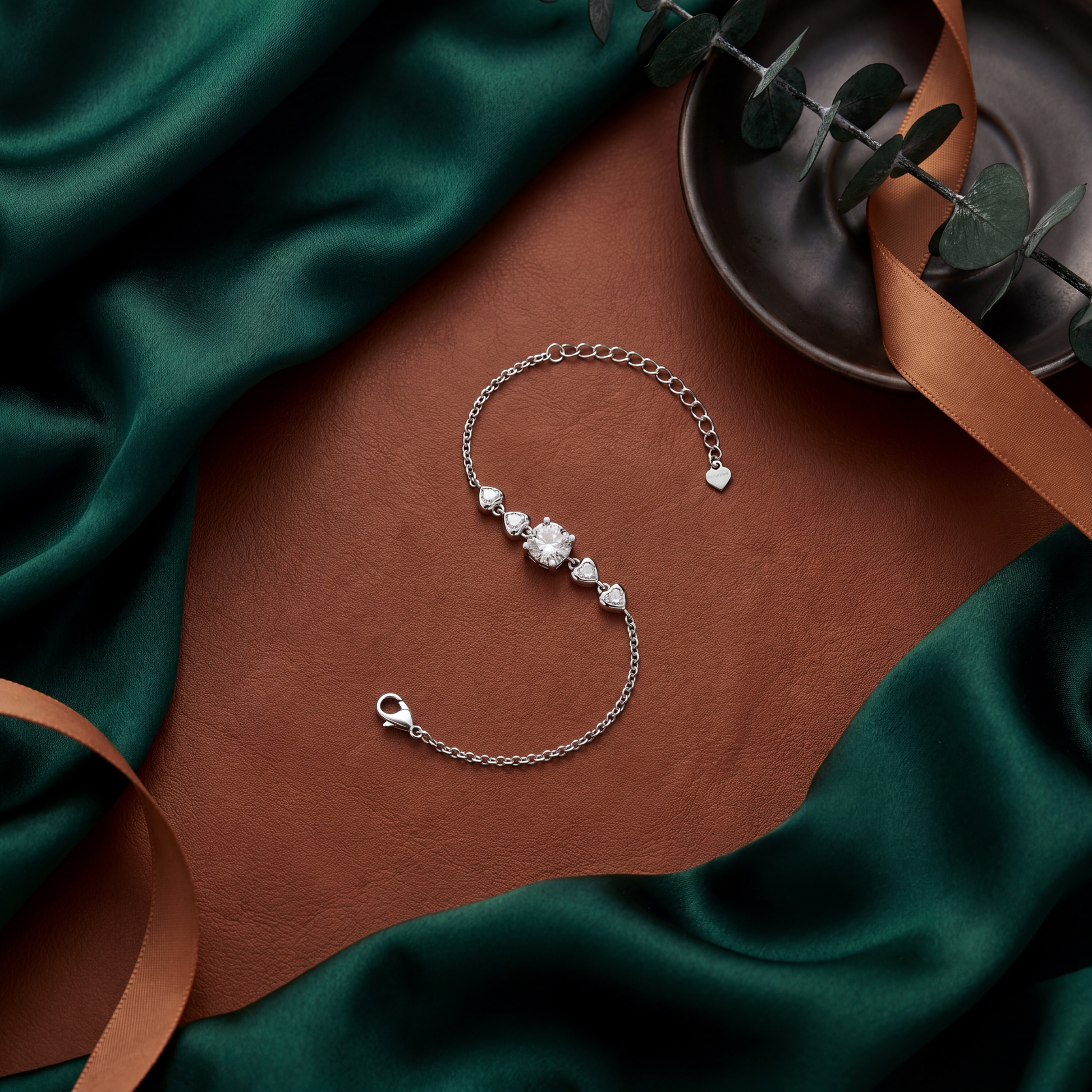 Silver bracelet with a diamond on a brown and green fabric background