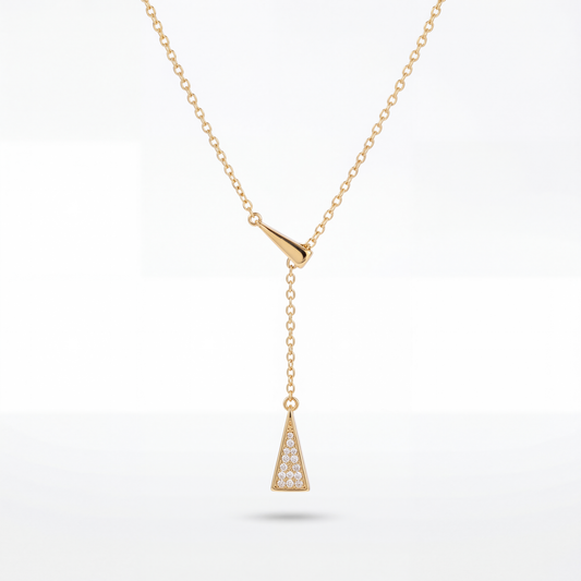 Gold necklace with a triangular pendant on a white background