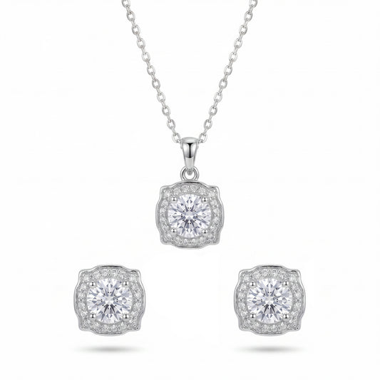 Diamond necklace and earrings set on a white background