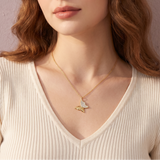The MOHRA Butterfly Pendant — brilliant VVS1 moissanite on one wing, high-polish gold on the other
