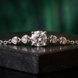 Diamond bracelet on a dark surface with a blurred green background