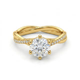 Gold ring with a large diamond and smaller diamonds on the band against a white background